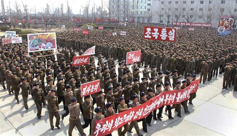 North Koreans attend a rally held to gather their willingness for a victory in a possible war against the United States and South Korea in N North Koreans attend a rally held to gather their willingness for a victory in a possible war against the United States and South Korea in N