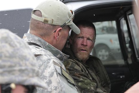 Troy James Knapp, known as the "Mountain Man," is taken into custody by Sanpete County sheriffs in this April 2, 2013 handout photo, after b Troy James Knapp, known as the "Mountain Man," is taken into custody by Sanpete County sheriffs in this April 2, 2013 handout photo, after b