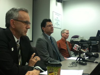 Brad Karger (L) and Scott Parks (C) answer questions about injured officers in the Marathon County Jail Brad Karger (L) and Scott Parks (C) answer questions about injured officers in the Marathon County Jail