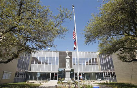 The flags fly half staff at Kaufman County Courthouse where slain District Attorney Mike McLelland worked in Kaufman, Texas April 1, 2013. R The flags fly half staff at Kaufman County Courthouse where slain District Attorney Mike McLelland worked in Kaufman, Texas April 1, 2013. R