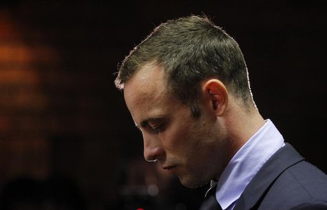 Oscar Pistorius stands at the dock before the start of proceedings at a Pretoria magistrates court February 22, 2013. REUTERS/Mike Hutchings Oscar Pistorius stands at the dock before the start of proceedings at a Pretoria magistrates court February 22, 2013. REUTERS/Mike Hutchings