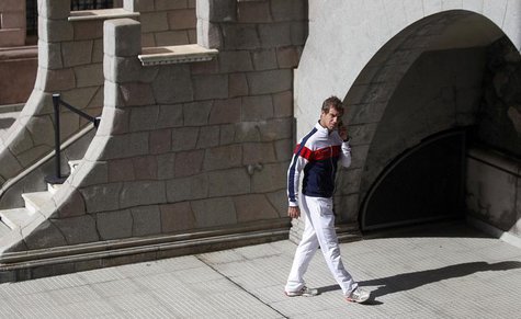 France's Richard Gasquet talks on the phone after the official draw of their upcoming Davis Cup tennis match against Argentina in Buenos Air France's Richard Gasquet talks on the phone after the official draw of their upcoming Davis Cup tennis match against Argentina in Buenos Air