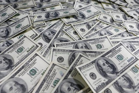 One hundred dollar notes are seen in this photo illustration at a bank in Seoul January 9, 2013. REUTERS/Lee Jae-Won One hundred dollar notes are seen in this photo illustration at a bank in Seoul January 9, 2013. REUTERS/Lee Jae-Won