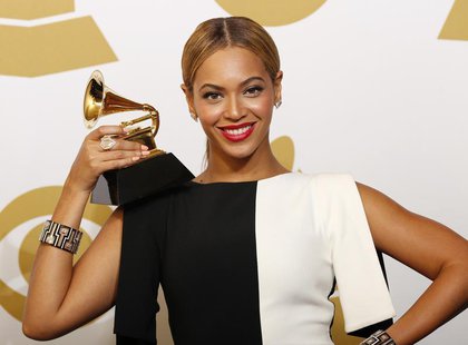 Beyonce poses with her award for Best Traditional R&B Performance for "Love On Top" backstage at the 55th annual Grammy Awards in Los Angele Beyonce poses with her award for Best Traditional R&B Performance for "Love On Top" backstage at the 55th annual Grammy Awards in Los Angele