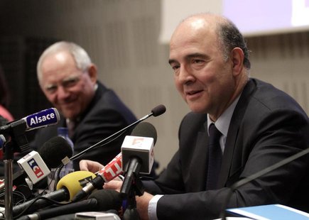 French Finance Minister Pierre Moscovici (R) speaks during a meeting with Germany's Finance Minister Wolfgang Schauble at the French Nationa French Finance Minister Pierre Moscovici (R) speaks during a meeting with Germany's Finance Minister Wolfgang Schauble at the French Nationa