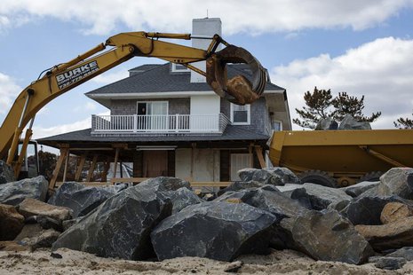 Heavy machinery moves large rocks to build a new sea wall nearly five months after the landfall of Superstorm Sandy in Bay Head, New Jersey, Heavy machinery moves large rocks to build a new sea wall nearly five months after the landfall of Superstorm Sandy in Bay Head, New Jersey,