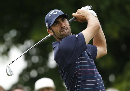 Spain's Alvaro Quiros tees off a ball at the third hole during the first day of the International Golf Open in Pulheim near Cologne June 21, Spain's Alvaro Quiros tees off a ball at the third hole during the first day of the International Golf Open in Pulheim near Cologne June 21,
