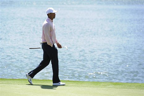 Tiger Woods of the U.S. walks along the 12th green during the 2013 Tavistock Cup golf tournament at Isleworth Golf and Country Club in Winde Tiger Woods of the U.S. walks along the 12th green during the 2013 Tavistock Cup golf tournament at Isleworth Golf and Country Club in Winde