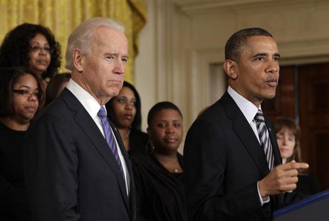 U.S. President Barack Obama (R) delivers remarks next to Vice President Joe Biden on common-sense measures to protect children from gun viol U.S. President Barack Obama (R) delivers remarks next to Vice President Joe Biden on common-sense measures to protect children from gun viol