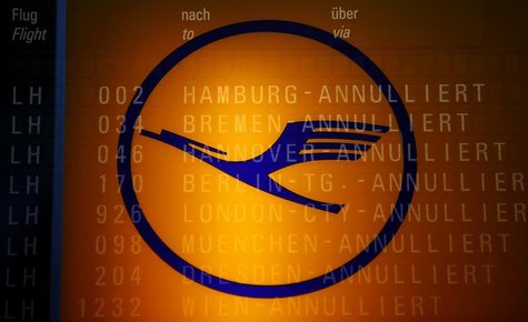 The logo of German air carrier Lufthansa and the cancelled flights on a flight schedule board are seen at the Fraport airport in Frankfurt, The logo of German air carrier Lufthansa and the cancelled flights on a flight schedule board are seen at the Fraport airport in Frankfurt,