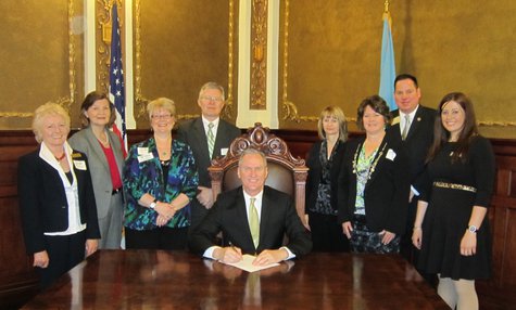 S.D. Governor Dennis Daugaard signs SB 235, creating the Housing Opportunity Fund. - Photo by SDHOF S.D. Governor Dennis Daugaard signs SB 235, creating the Housing Opportunity Fund. - Photo by SDHOF