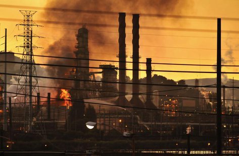 Firefighters douse a flame at the Chevron oil refinery in in Richmond, California August 6, 2012. REUTERS/Josh Edelson Firefighters douse a flame at the Chevron oil refinery in in Richmond, California August 6, 2012. REUTERS/Josh Edelson