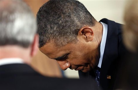 U.S. President Barack Obama bows his head in prayer during the Easter Prayer Breakfast held in the East Room of the White House in Washingto U.S. President Barack Obama bows his head in prayer during the Easter Prayer Breakfast held in the East Room of the White House in Washingto