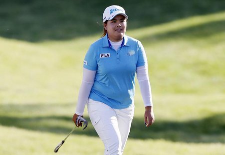 Inbee Park of South Korea smiles as she is applauded by the crowd while walking to her ball on the 17th green during the third round of the Inbee Park of South Korea smiles as she is applauded by the crowd while walking to her ball on the 17th green during the third round of the