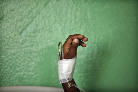 The hand of a child, who has been put on drip after showing symptoms of dengue fever, is seen in the pediatric emergency room of a public ho The hand of a child, who has been put on drip after showing symptoms of dengue fever, is seen in the pediatric emergency room of a public ho