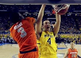 Michigan Wolverines forward Mitch McGary (4) dunks on Syracuse Orange forward Jerami Grant (3) in the first half of their NCAA men's Final Four basketball game in Atlanta, Georgia April 6, 2013. Reuters/Daniel J. Beauvais-Pool
Michigan Wolverines forward Mitch McGary (4) dunks on Syracuse Orange forward Jerami Grant (3) in the first half of their NCAA men's Final Four basketball game in Atlanta, Georgia April 6, 2013. Reuters/Daniel J. Beauvais-Pool