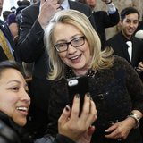 U.S. Secretary of State Hillary Clinton poses for a photo upon departure from her last day in office at the State Department in Washington F