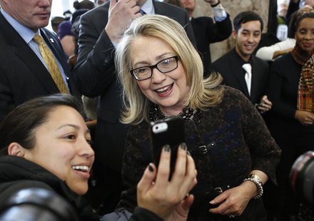 U.S. Secretary of State Hillary Clinton poses for a photo upon departure from her last day in office at the State Department in Washington F U.S. Secretary of State Hillary Clinton poses for a photo upon departure from her last day in office at the State Department in Washington F