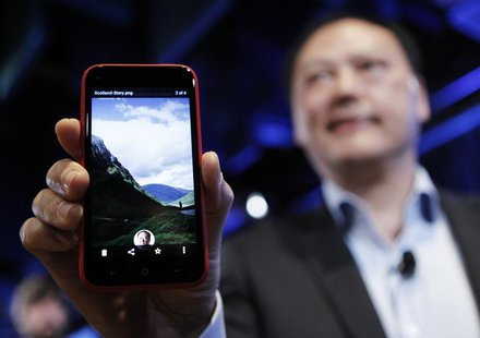 HTC CEO Peter Chou holds an HTC First phone showing the new app Facebook Home for Android during a press event in Menlo Park, California Apr HTC CEO Peter Chou holds an HTC First phone showing the new app Facebook Home for Android during a press event in Menlo Park, California Apr