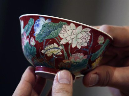 A magnificent Ruby-Ground Falangcai "Double-Lotus" Bowl Blue Enamel Yuzhi Mark and Period of Kangxi is shown after Hong Kong Chinese ceramic A magnificent Ruby-Ground Falangcai "Double-Lotus" Bowl Blue Enamel Yuzhi Mark and Period of Kangxi is shown after Hong Kong Chinese ceramic