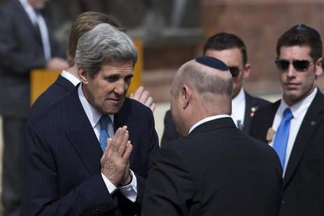 U.S. Secretary of State John Kerry (L) greets an Israeli official before a wreath-laying ceremony marking Israel's annual day of Holocaust r U.S. Secretary of State John Kerry (L) greets an Israeli official before a wreath-laying ceremony marking Israel's annual day of Holocaust r