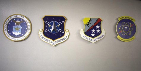 Medallions for (L-R) the U.S. Air Force, Air Force Space Command, Air Force Cyber Command and he Air Force Space Command Network Operations Medallions for (L-R) the U.S. Air Force, Air Force Space Command, Air Force Cyber Command and he Air Force Space Command Network Operations