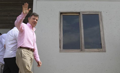 Colombia's President Juan Manuel Santos waves during the delivery of 568 new homes to families living in high-risk areas in Buenaventura, Va Colombia's President Juan Manuel Santos waves during the delivery of 568 new homes to families living in high-risk areas in Buenaventura, Va