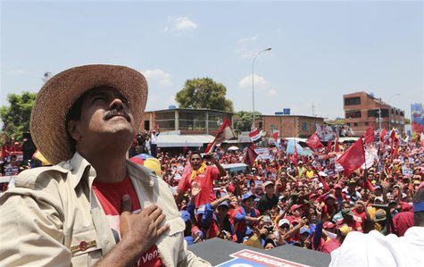 Venezuela's acting President and presidential candidate Nicolas Maduro greets supporters during a campaign rally at the state of Apure, in t Venezuela's acting President and presidential candidate Nicolas Maduro greets supporters during a campaign rally at the state of Apure, in t