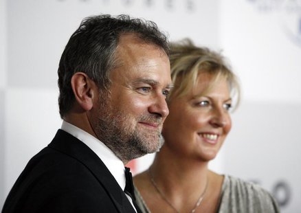 Actor Hugh Bonneville and his wife Lulu Evans arrive at the NBC Universal after-party following the 69th annual Golden Globe Awards in Bever Actor Hugh Bonneville and his wife Lulu Evans arrive at the NBC Universal after-party following the 69th annual Golden Globe Awards in Bever