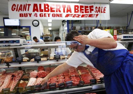 Clayton Colliou, a butcher at Bon Ton Meat Market, organizes choice cuts of Alberta beef in Calgary, Alberta, October 3, 2012. REUTERS/Todd Clayton Colliou, a butcher at Bon Ton Meat Market, organizes choice cuts of Alberta beef in Calgary, Alberta, October 3, 2012. REUTERS/Todd