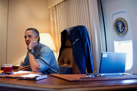 U.S. President Barack Obama talks on the phone with NASA's Curiosity Mars rover team aboard Air Force One during a flight to Offutt Air Forc U.S. President Barack Obama talks on the phone with NASA's Curiosity Mars rover team aboard Air Force One during a flight to Offutt Air Forc