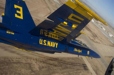 Members of the U.S. Navy flight demonstration squadron, the Blue Angels, perform the diamond 360 maneuver during a practice flight over Nava Members of the U.S. Navy flight demonstration squadron, the Blue Angels, perform the diamond 360 maneuver during a practice flight over Nava