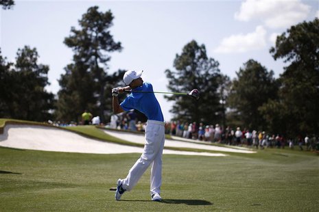 Asia-Pacific Amateur Championship winner, 14 year old Guan Tianlang of China hits his tee shot on the third hole during a practice round in Asia-Pacific Amateur Championship winner, 14 year old Guan Tianlang of China hits his tee shot on the third hole during a practice round in