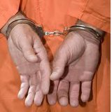 Man arrested with stash of weapons