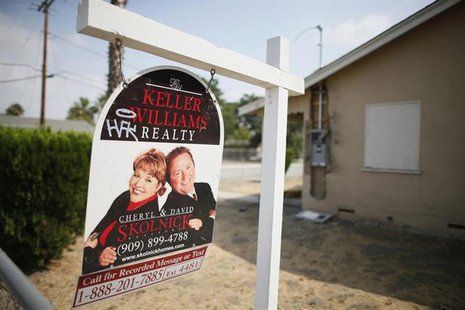 A real estate sign is seen outside a deserted home stripped of its copper wiring in San Bernardino, California September 11, 2012. REUTERS/L A real estate sign is seen outside a deserted home stripped of its copper wiring in San Bernardino, California September 11, 2012. REUTERS/L