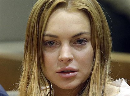 Actress Lindsay Lohan sits at a hearing in Los Angeles Superior Court in Los Angeles, California March 18, 2013. REUTERS/Reed Saxon/Pool Actress Lindsay Lohan sits at a hearing in Los Angeles Superior Court in Los Angeles, California March 18, 2013. REUTERS/Reed Saxon/Pool