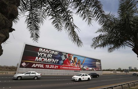 Vehicles travel past a large Bahrain Formula One advertising billboard on main highway leading to Bahrain Internaitonal Circuit, in Manama A Vehicles travel past a large Bahrain Formula One advertising billboard on main highway leading to Bahrain Internaitonal Circuit, in Manama A