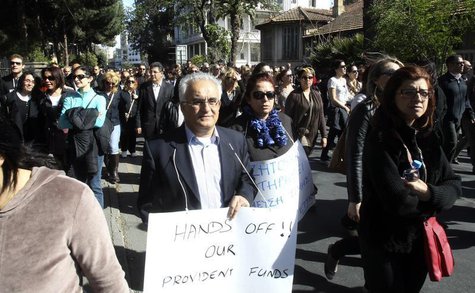Hundreds of Cypriot bank workers protest against the possibility of their pensions being affected should the government decide to restructur Hundreds of Cypriot bank workers protest against the possibility of their pensions being affected should the government decide to restructur