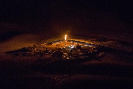 An aerial image shows a natural gas flare after sunset outside of Williston, North Dakota March 12, 2013. REUTERS/Shannon Stapleton An aerial image shows a natural gas flare after sunset outside of Williston, North Dakota March 12, 2013. REUTERS/Shannon Stapleton
