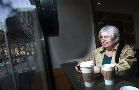 Bea Dewing is seen though the window of a cafe as she checks her phone for messages in her search for a job in New York, March 21, 2013. REU Bea Dewing is seen though the window of a cafe as she checks her phone for messages in her search for a job in New York, March 21, 2013. REU