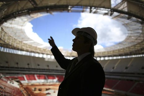 A worker is seen at the National Mane Garrincha Stadium undergoing construction in Brasilia April, 8, 2013. REUTERS/Ueslei Marcelino A worker is seen at the National Mane Garrincha Stadium undergoing construction in Brasilia April, 8, 2013. REUTERS/Ueslei Marcelino