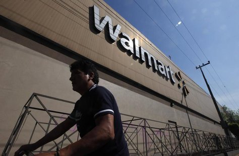 A person walks outside a Wal-Mart store in Mexico City January 11, 2013. REUTERS/Edgard Garrido A person walks outside a Wal-Mart store in Mexico City January 11, 2013. REUTERS/Edgard Garrido