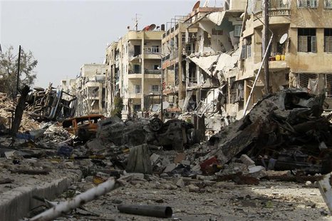 Damaged vehicles fill a street lined with damaged buildings in Aleppo's Salaheddine district, April 8, 2013. REUTERS/Malek Alshemali Damaged vehicles fill a street lined with damaged buildings in Aleppo's Salaheddine district, April 8, 2013. REUTERS/Malek Alshemali