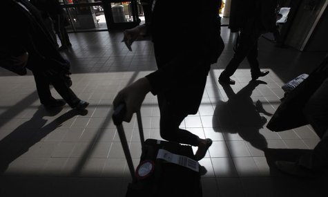 Passengers cast shadows as they walk along a terminal at Los Angeles International Airport in Los Angeles, California March 4, 2013. REUTERS Passengers cast shadows as they walk along a terminal at Los Angeles International Airport in Los Angeles, California March 4, 2013. REUTERS