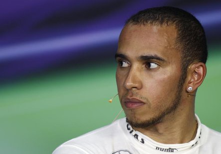 Mercedes Formula One driver Lewis Hamilton of Britain attends a post race news conference after the Malaysian F1 Grand Prix at Sepang Intern Mercedes Formula One driver Lewis Hamilton of Britain attends a post race news conference after the Malaysian F1 Grand Prix at Sepang Intern