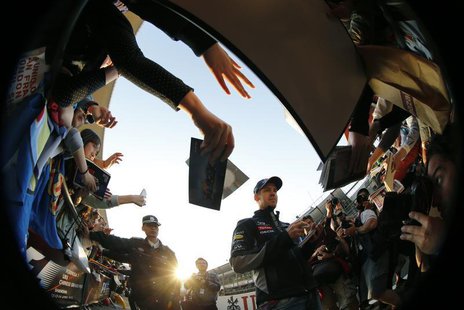 Red Bull Formula One driver Sebastian Vettel (C) of Germany signs his autograph at the Chinese Grand Prix at the Shanghai International Circ Red Bull Formula One driver Sebastian Vettel (C) of Germany signs his autograph at the Chinese Grand Prix at the Shanghai International Circ