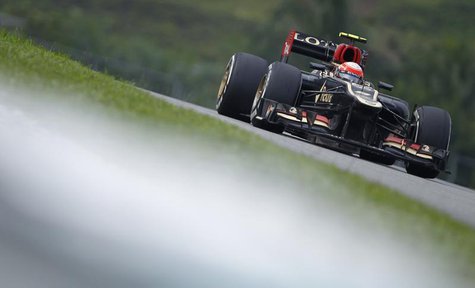 Lotus Formula One driver Romain Grosjean of France drives during the Malaysian F1 Grand Prix at Sepang International Circuit outside Kuala L Lotus Formula One driver Romain Grosjean of France drives during the Malaysian F1 Grand Prix at Sepang International Circuit outside Kuala L