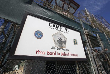A guard opens the gate at the entrance to Camp VI, a prison used to house detainees at the U.S. Naval Base at Guantanamo Bay in this file ph A guard opens the gate at the entrance to Camp VI, a prison used to house detainees at the U.S. Naval Base at Guantanamo Bay in this file ph