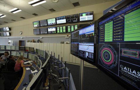 Technicians look at computer screens during the preparation of the beam in the Control Room of the Large Hadron Collider (LHC) at the Europe Technicians look at computer screens during the preparation of the beam in the Control Room of the Large Hadron Collider (LHC) at the Europe