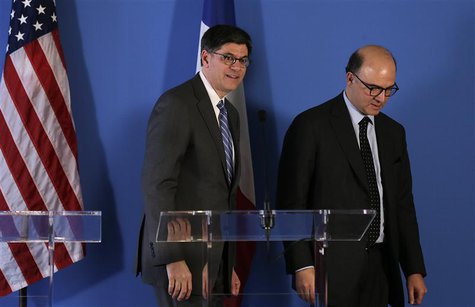 French Finance Minister Pierre Moscovici (R) and U.S. Treasury Secretary Jack Lew leave at the end of their joint news conference after a me French Finance Minister Pierre Moscovici (R) and U.S. Treasury Secretary Jack Lew leave at the end of their joint news conference after a me